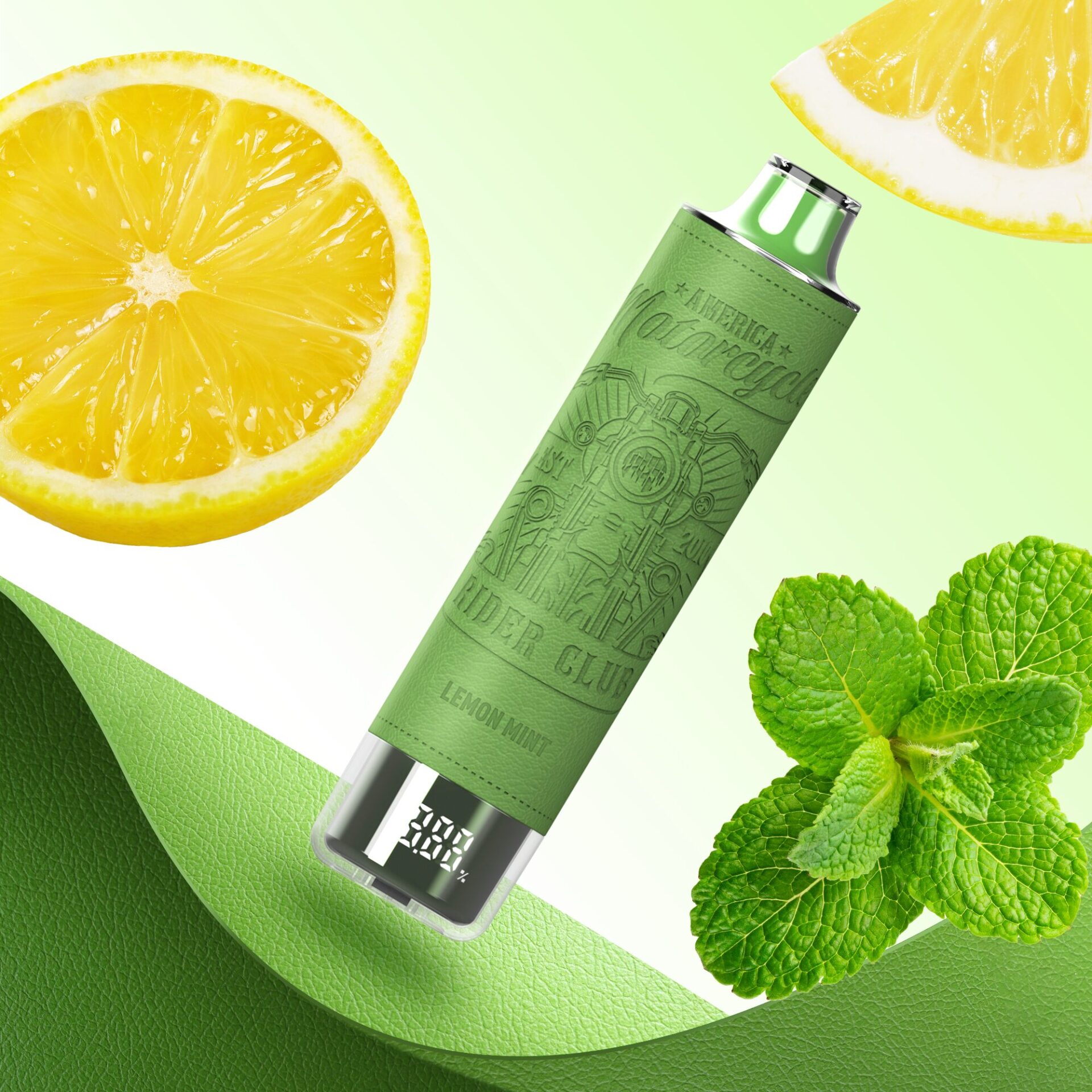 A green vape device with an engraved design, labeled "Lemon Mint," displayed alongside fresh mint leaves and slices of lemon, set against a gradient green background.
