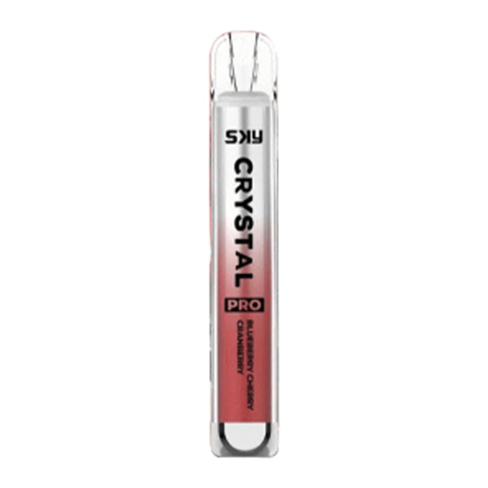 A transparent cylindrical vape device labeled "SKY CRYSTAL PRO" with "BLUEBERRY CHERRY CRANBERRY" written at the bottom, featuring a gradient pink design.