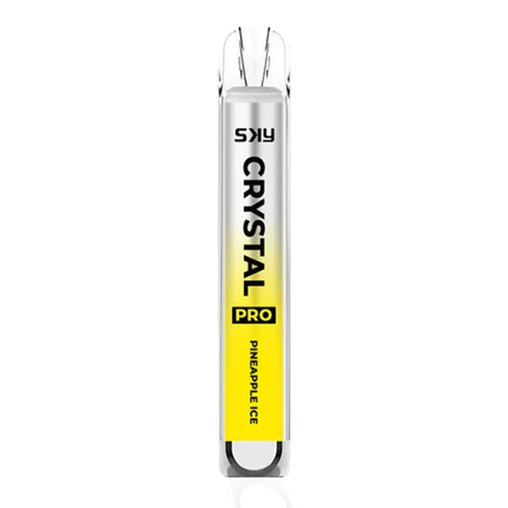 A disposable vape device labeled "SKY CRYSTAL PRO" with a gradient design from silver to yellow, featuring the flavor "Pineapple Ice."