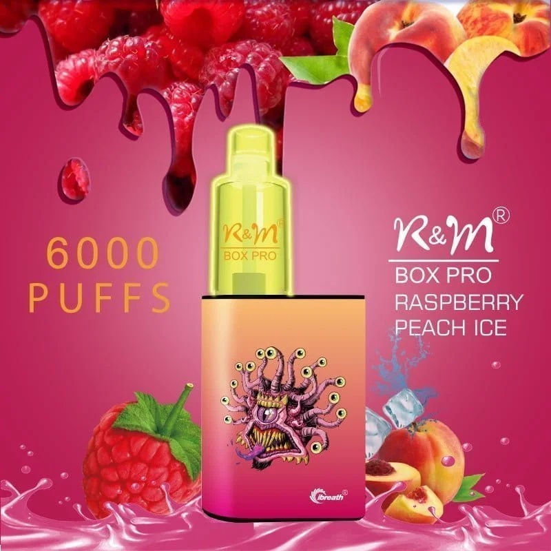 A pink-themed vape device labeled "R&M Box Pro Raspberry Peach Ice" with a monster graphic, surrounded by raspberries, peaches, ice cubes, and dripping liquid, accompanied by the text "6000 PUFFS."