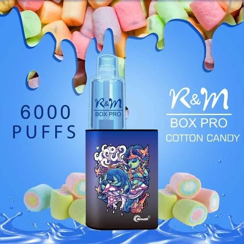 Blue-themed promotional image for the R&M Box Pro Cotton Candy vape, featuring a colorful cartoon design on the device, "6000 puffs" text, and marshmallow elements in the background.