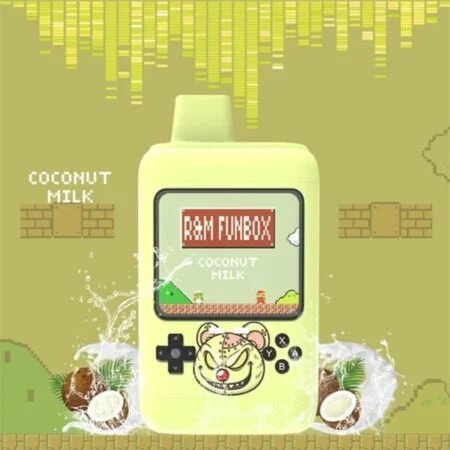 Un dispositivo portátil amarillo parecido a una consola de juegos retro en cuya pantalla aparece el texto "R&M FUNBOX Coconut Milk", rodeado de salpicaduras de leche de coco y mitades de coco sobre un fondo pixelado.