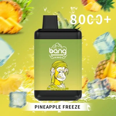 A Bang King Pineapple Freeze vape device with a green and yellow design featuring a monkey illustration, "8000 puffs+" text, and tropical pineapple and ice cube elements in the background.