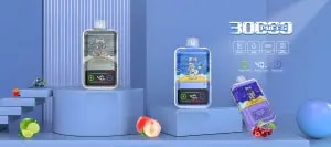 Three vaping devices with colorful designs, labeled "Banana Orange Ice," "Guava Ice," and "Blue Raspberry," positioned on a blue platform, surrounded by various fruits like strawberries, blueberries, limes, and peaches. Accompanying icons indicate specifications such as 30,000 puffs, 1000mAh battery, e-liquid level, and wattage settings.