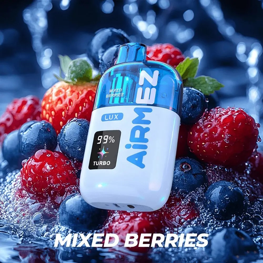 A blue and white AIRMEN pod labeled Mixed Berries sits among fresh strawberries, blueberries, and raspberries with a water splash.