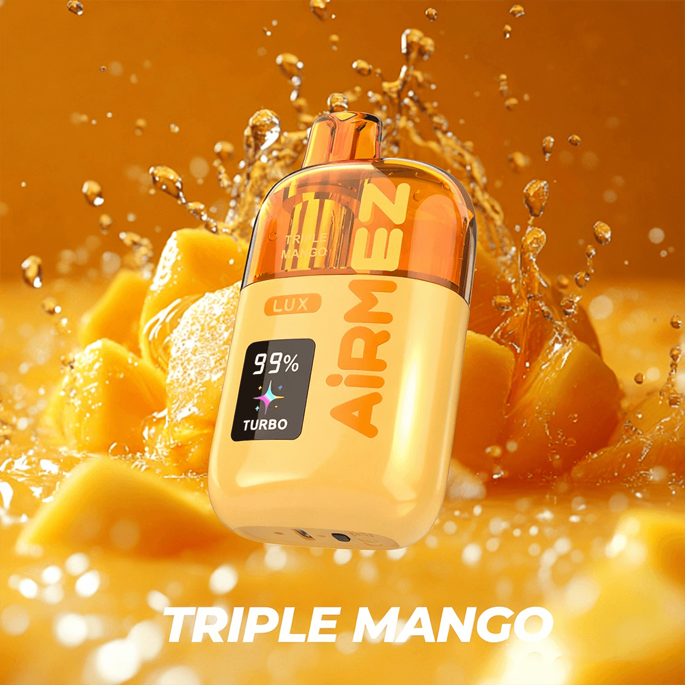 Mango-scent perfume bottle with an orange cap, labeled Triple Mango, surrounded by a splash of mango chunks.